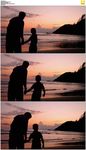 父子海滩看日落剪影