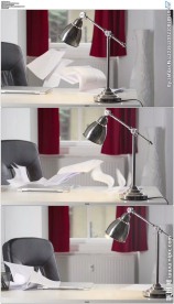 台灯办公桌上纸张飞舞