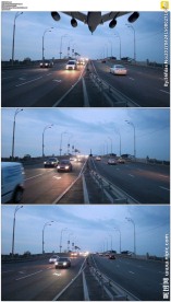 飞机在公路上空飞翔降落