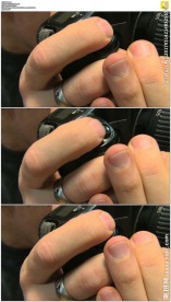 摄影师手指按下快门特写