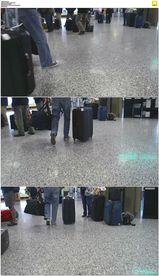 机场旅客提着包拖着行李箱