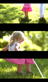 小女孩在草地上玩泡泡视频素材