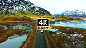 航拍大山公路上高速行驶的汽车